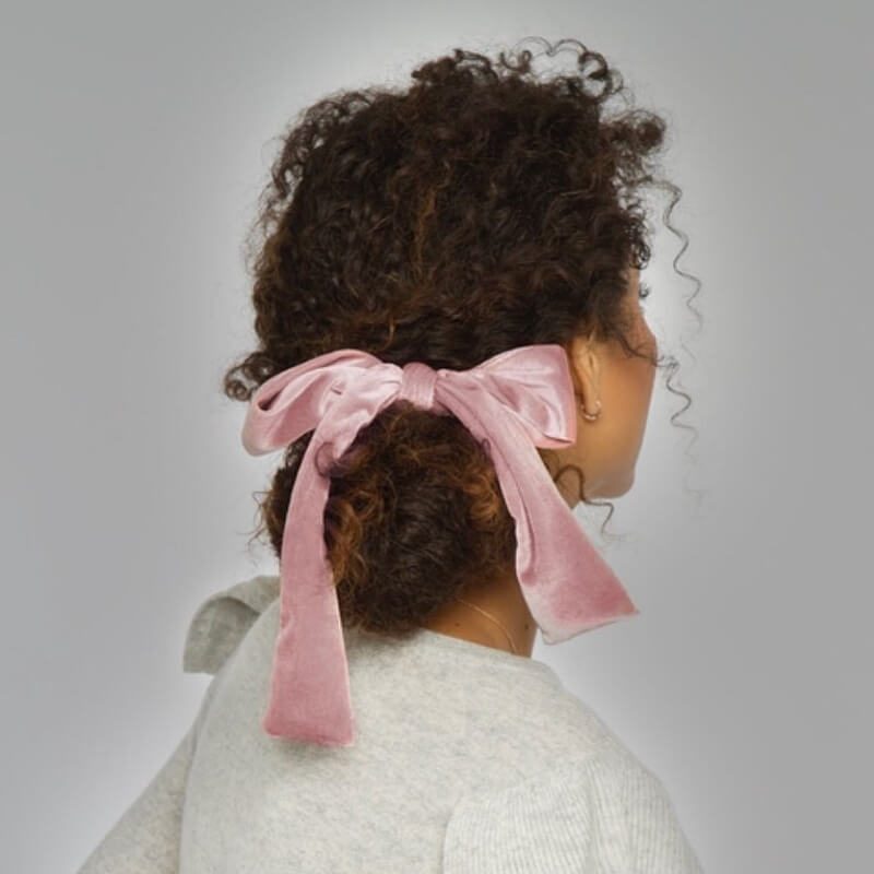 Low Bow Tie Bun For Curly Hairs