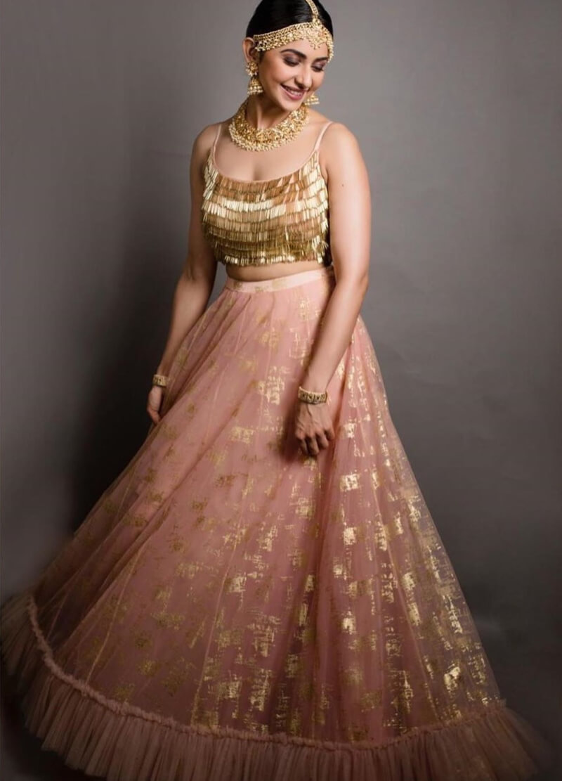 Rakul Preet in pink Raffle Lehenga with Embellished Blouse