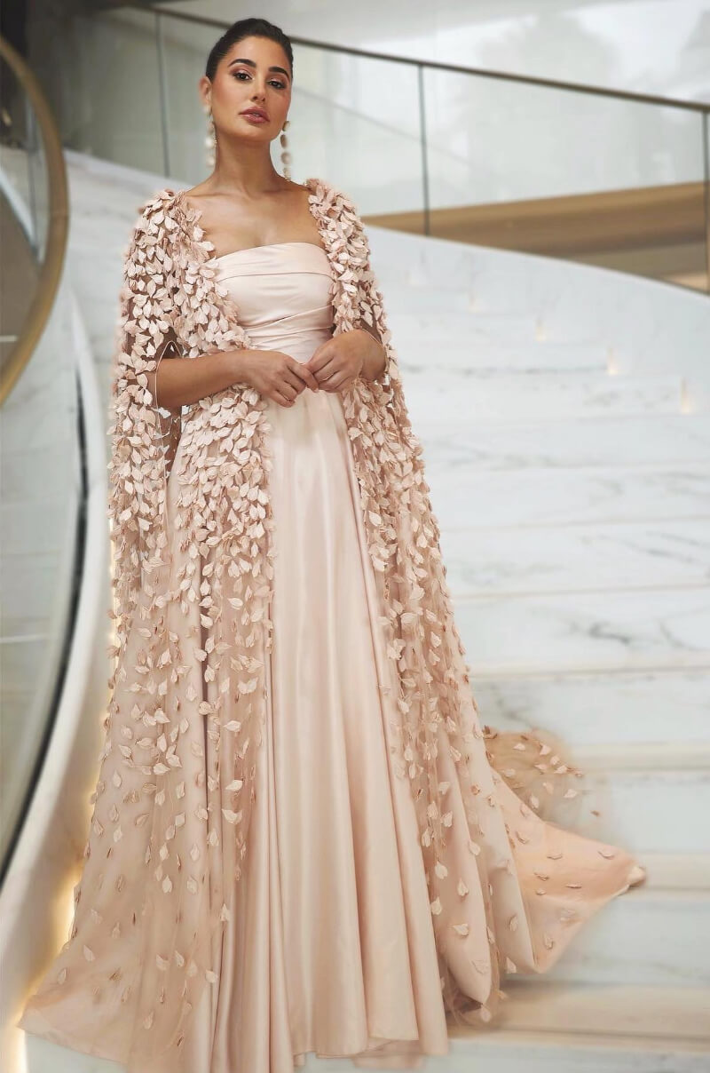 Actress Nargis Fakhri looked majestic blush pink gown with a cape