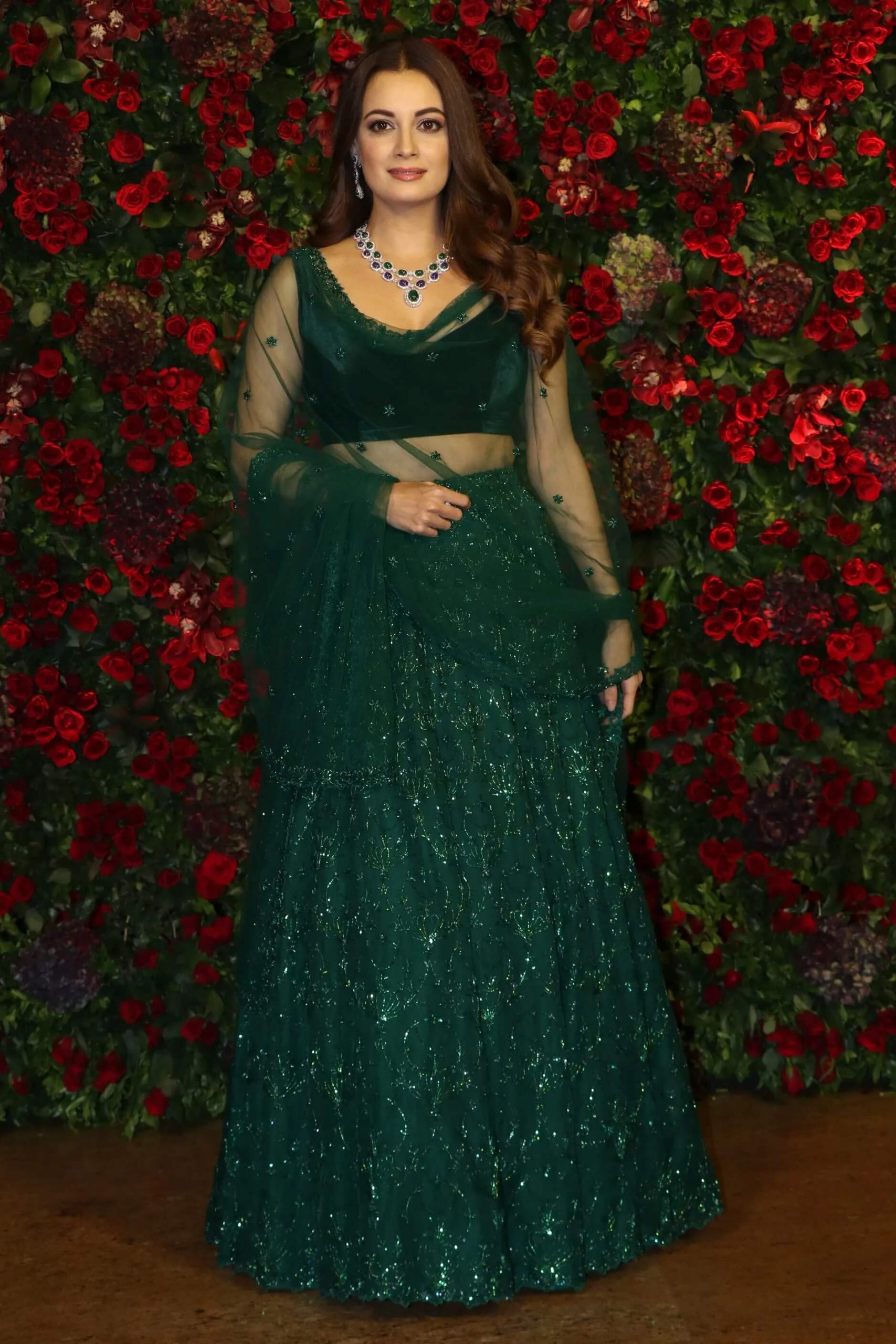 At Deepika And Ranveer's wedding, Dia wore a Bottle Green lehenga set with a sheer dupatta
