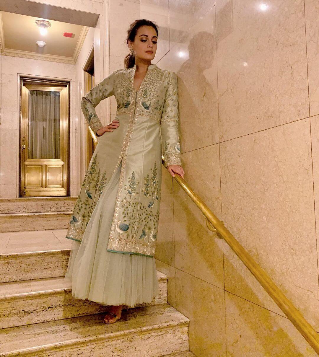 Dia Mirza wore a pistachio green, handpainted kurta set with 3D embroidery and sequins and a buoyant kurta skirt set by Anita Dongre