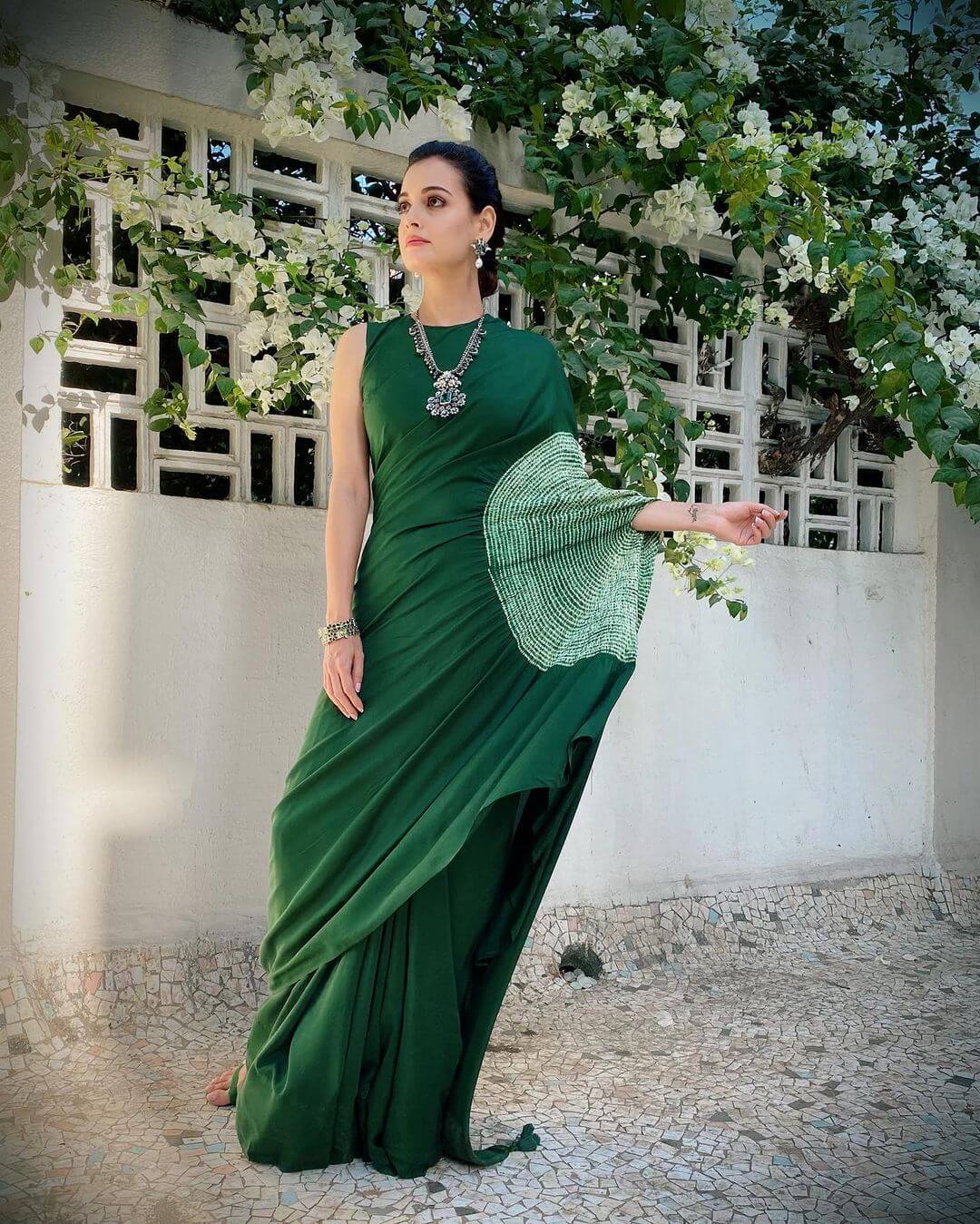 Dia Wore a unique Medium olive green drape saree with a shibori sleeve 