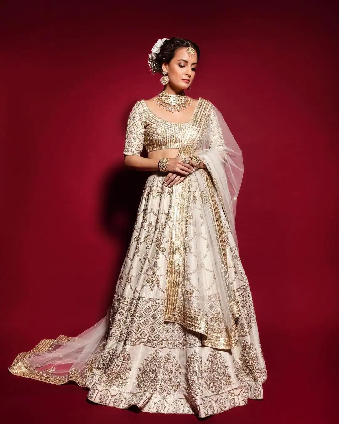 Rehnaa Hai Terre Dil Mein  Fame Actress Dia Mirza in a white and gold lehenga set