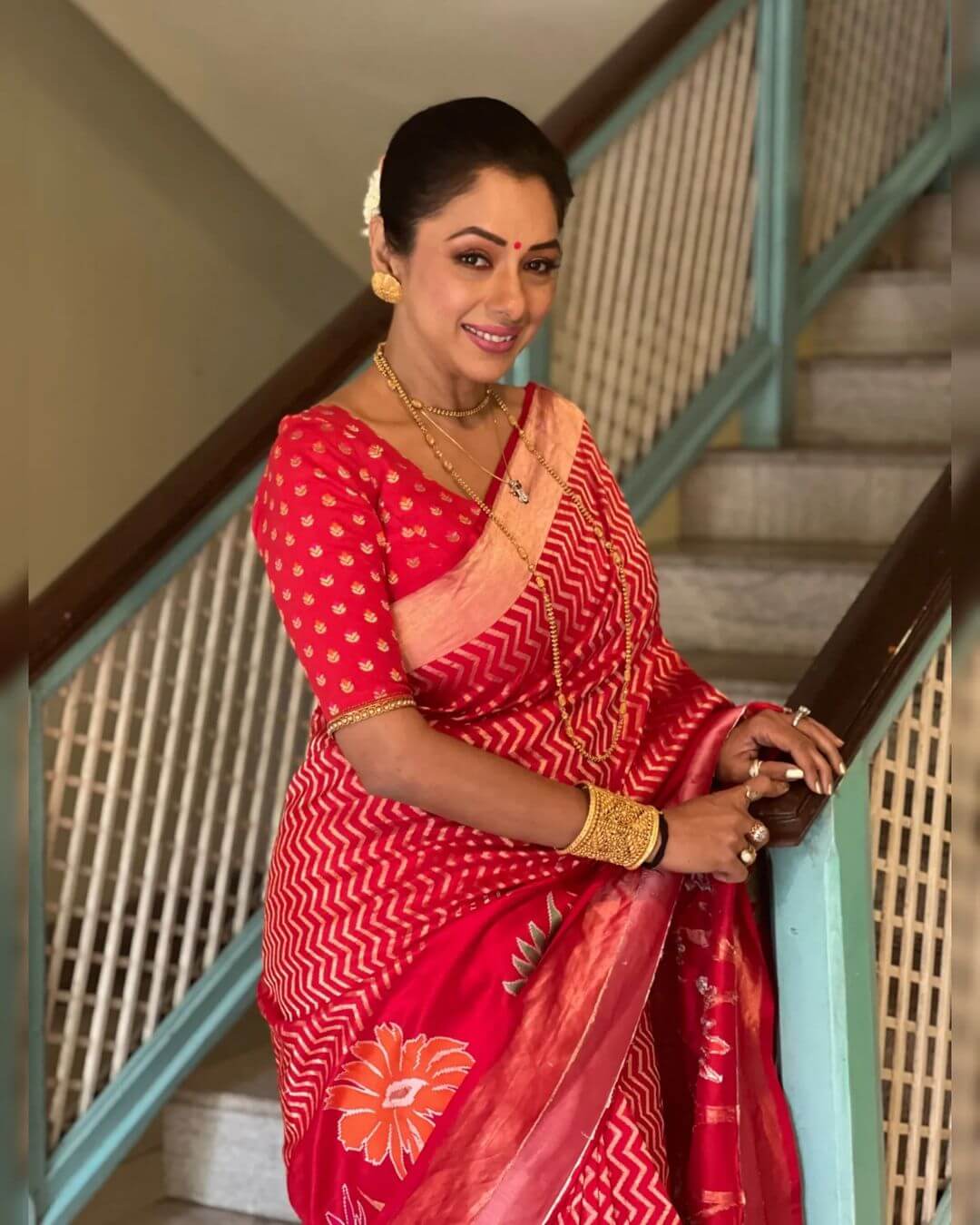 Rupali Ganguly Seen Posing In A Floral Print Pink Saree With Golden Jewellery And Gajra On Her Hair