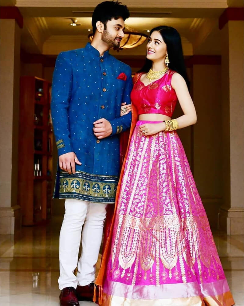 Actress Amrita Rao and RJ Anmol in a bright pink lehenga and vibrant blue kurtafestivect for any occasion