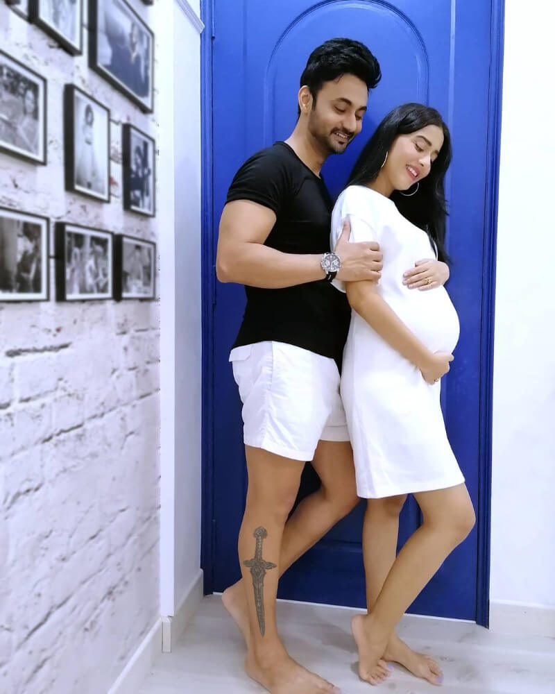 Amrita Rao and RJ Anmol in white and black outfits, celebrating the actress’s pre-pregnancy