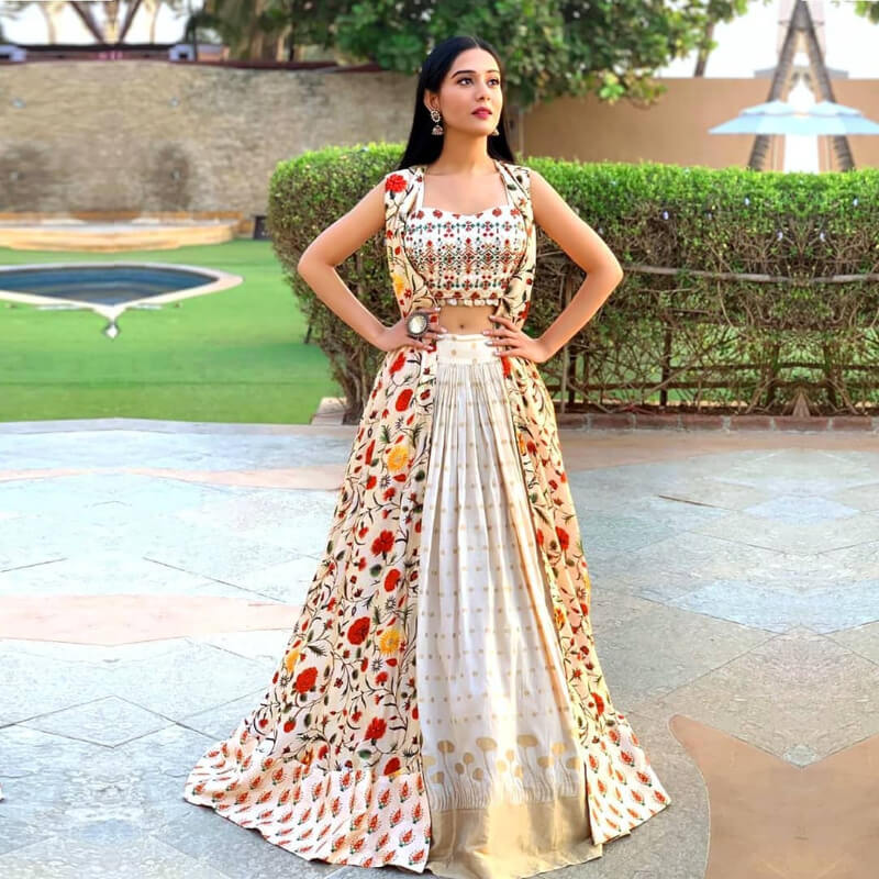 Amrita Rao in off-white skirt with an embroidered crop top and floral printed jacket, for the promotions of Thackeray
