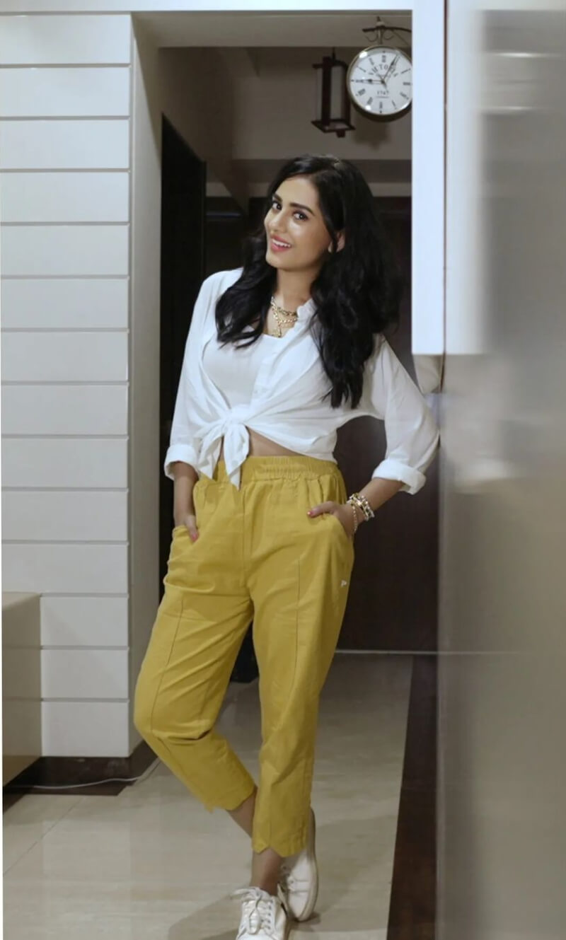 Amrita Rao in White Button Down Tie  Casual Top with lime green pants