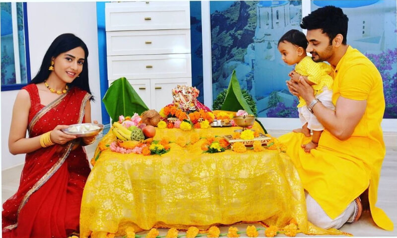Amrita Rao with her family celebrates Ganesh Chaturthi  in a red saree, while RJ Anmol is dressed in a yellow kurta