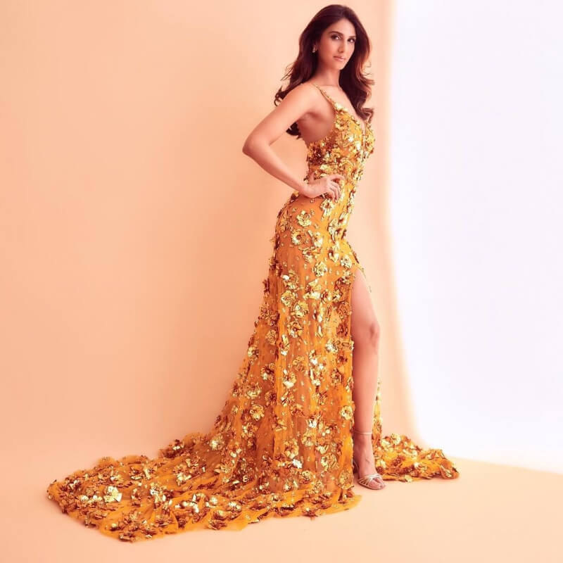 Bell Bottom  Actress Vaani Kapoor In Mustard yellow Floral Thigh High Slit dress