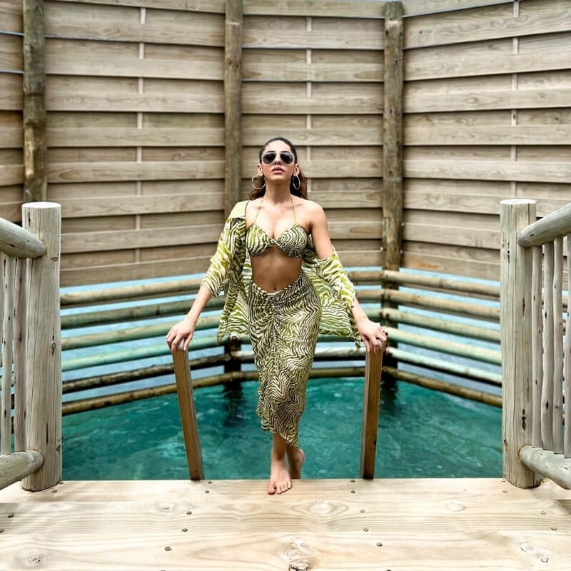 Bollywood Actress Alaya F in printed bikini top, matching skirt, and shrug