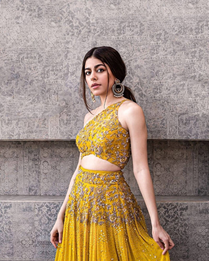 Bollywood Actress in yellow  lehenga with  one-shoulder blouse
