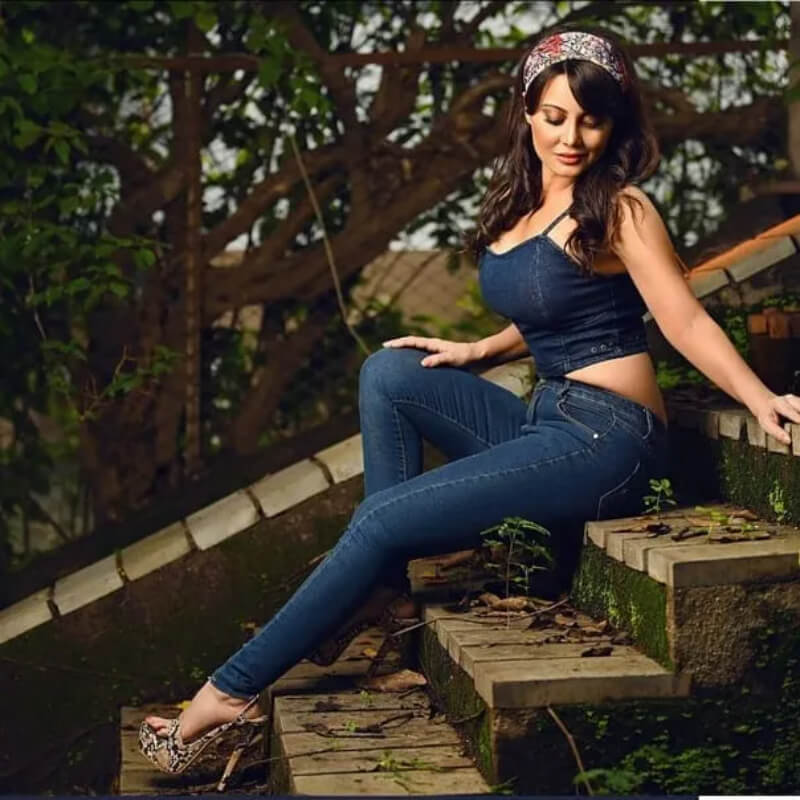 Bollywood Actress Minissha Lamba in a figure-hugging denim top with matching denim jeans