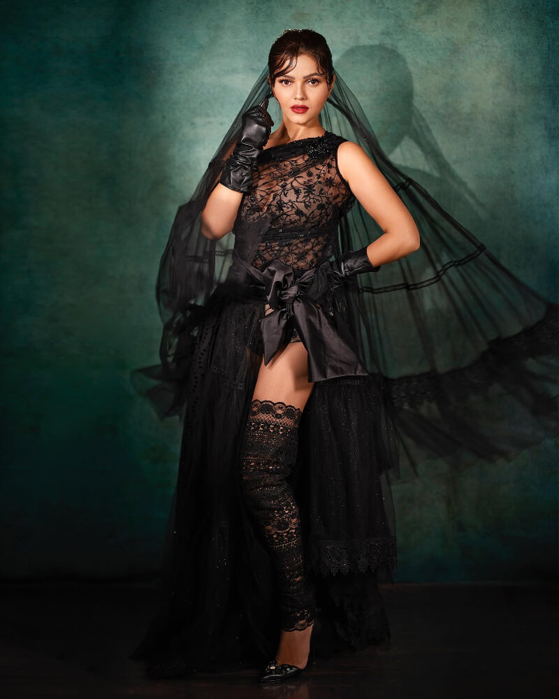 Bollywood actress Rubina in an all-black semi-sheer  look with gloves and a veil