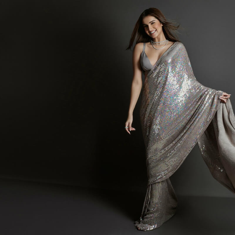 Bollywood DIva Tara Sutaria in silver tone sequin sari by Manish Malhotra