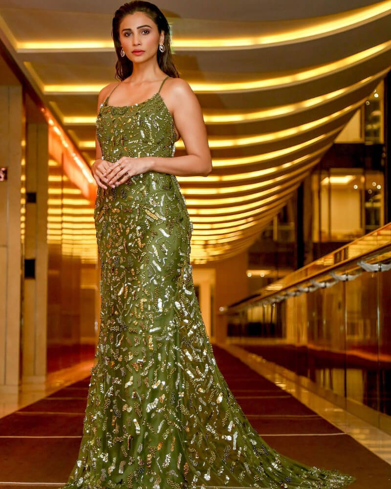 Daisy Shah looks glamorous in a strappy green gown