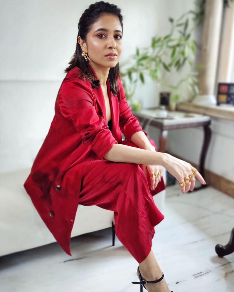 Indian actress Shweta in a red satin pantsuit by Aroka