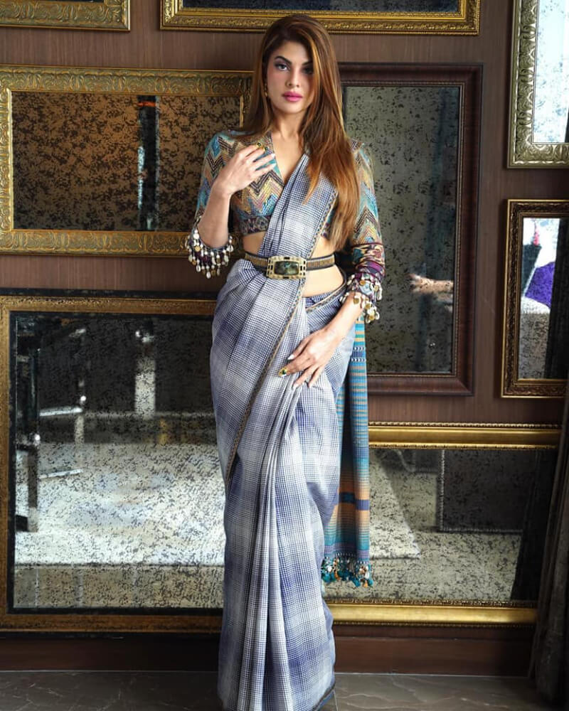 Jacqueline Fernandez in Printed handloom saree with a stone-studded gold belt by Tarun Tahiliani