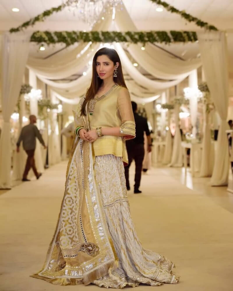 Mahira Khan wears short golden kurta paired with contrasting sharara and dupatta