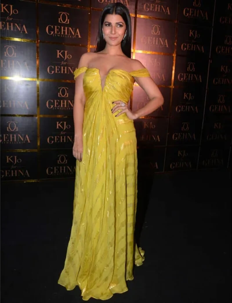 Nimrat Kaur in yellow Monisha Jaising gown with center-parted slick hair and diamond jewelry