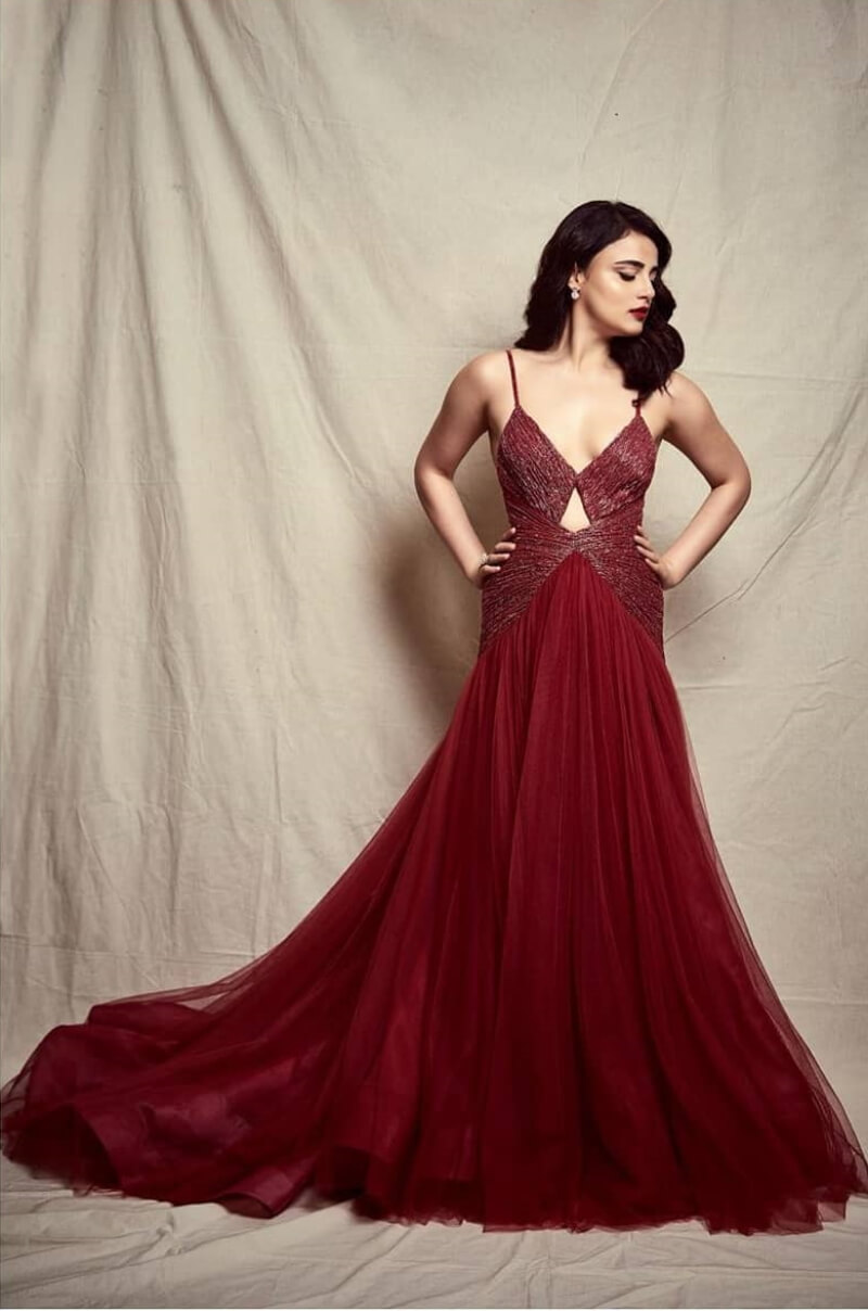 Radhika Madan in red floor length gown with shimmer on top