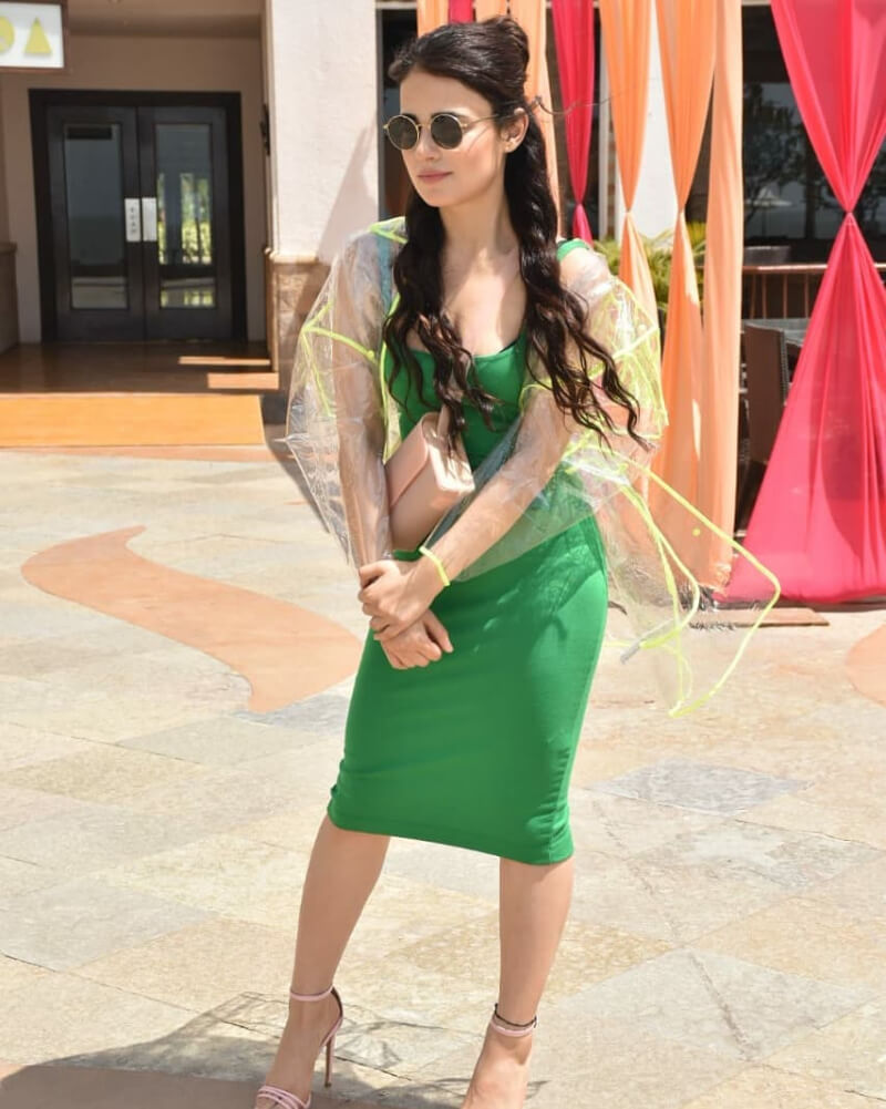 Radhika Madan in Square Neckline Bodycon Dress Green with Transparent Raincoat