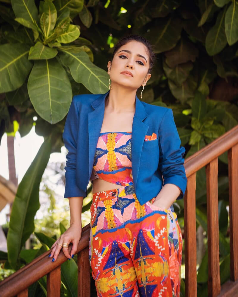 Shweta Tripathi actress from ‘Masaan’ in multicolored off-shoulder cropped top and trousers with a blue coat
