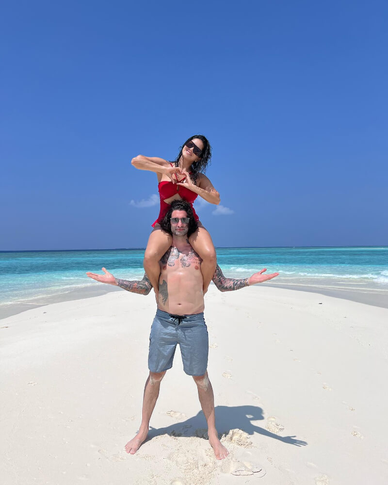 Sunny Leone Sitting On Daniel's shoulders In red monokini At Maldives