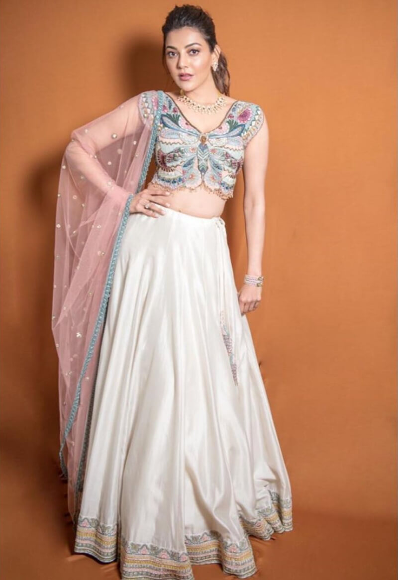 Tollywood star Kajal In  white lehenga with butterfly printed blouse and matching dupatta