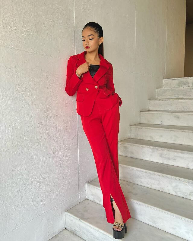 A Red Pantsuit With Black Top
