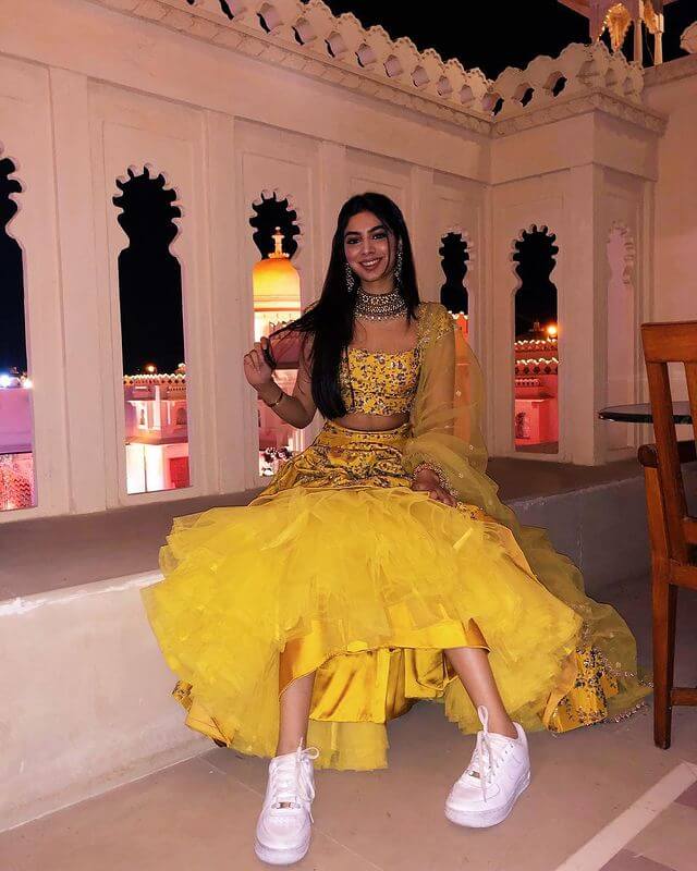 At her Friend's Wedding Khushi Kapoor in yellow lehenga paired with white sneakers