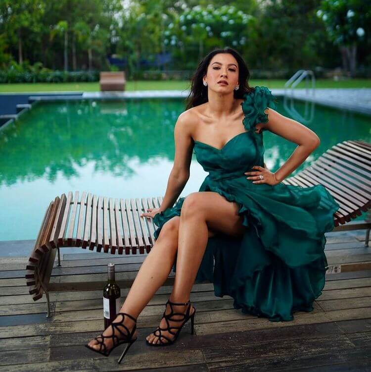 Bigg Boss Contestant Gauahar Khan in bottle green one-shoulder mini ruffle dress
