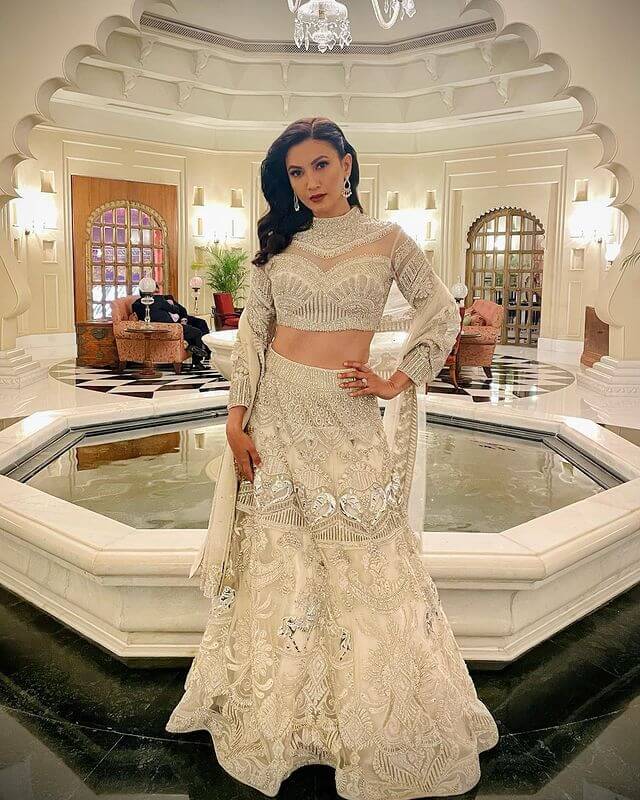 Bollywood Actress Gauahar Khan in a silver lehenga is the perfect wedding attire