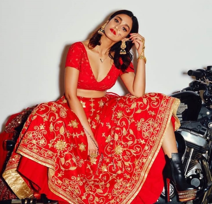 Bollywood Actress Ileana D’cruz Photoshoot In Red Lehenga As Carefree Indian Bride