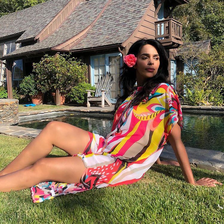 Hindi Movie Star Mallika Sherawat chilling in Los Angeles in a multi-colored loose-fitted maxi dress