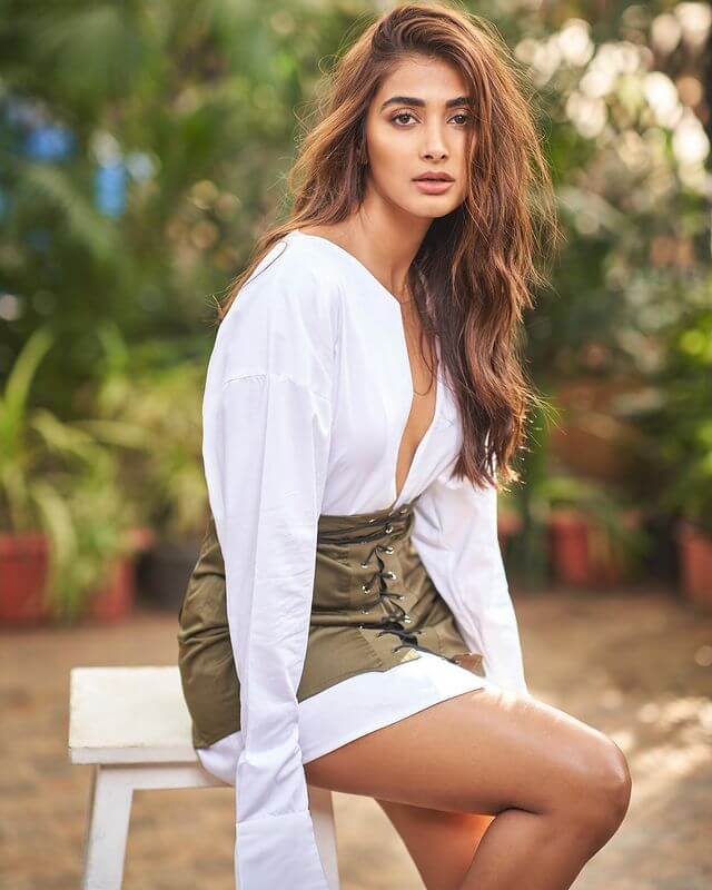 Pooja Hegde In White Shirt Dress Paired With Green Leather Skirt