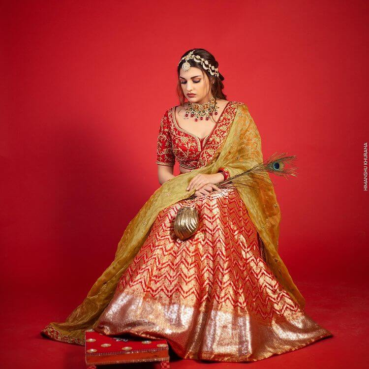 Punjabi Actor Looking Like Radha In Red Silk Lehenga With Embroidery Blouse