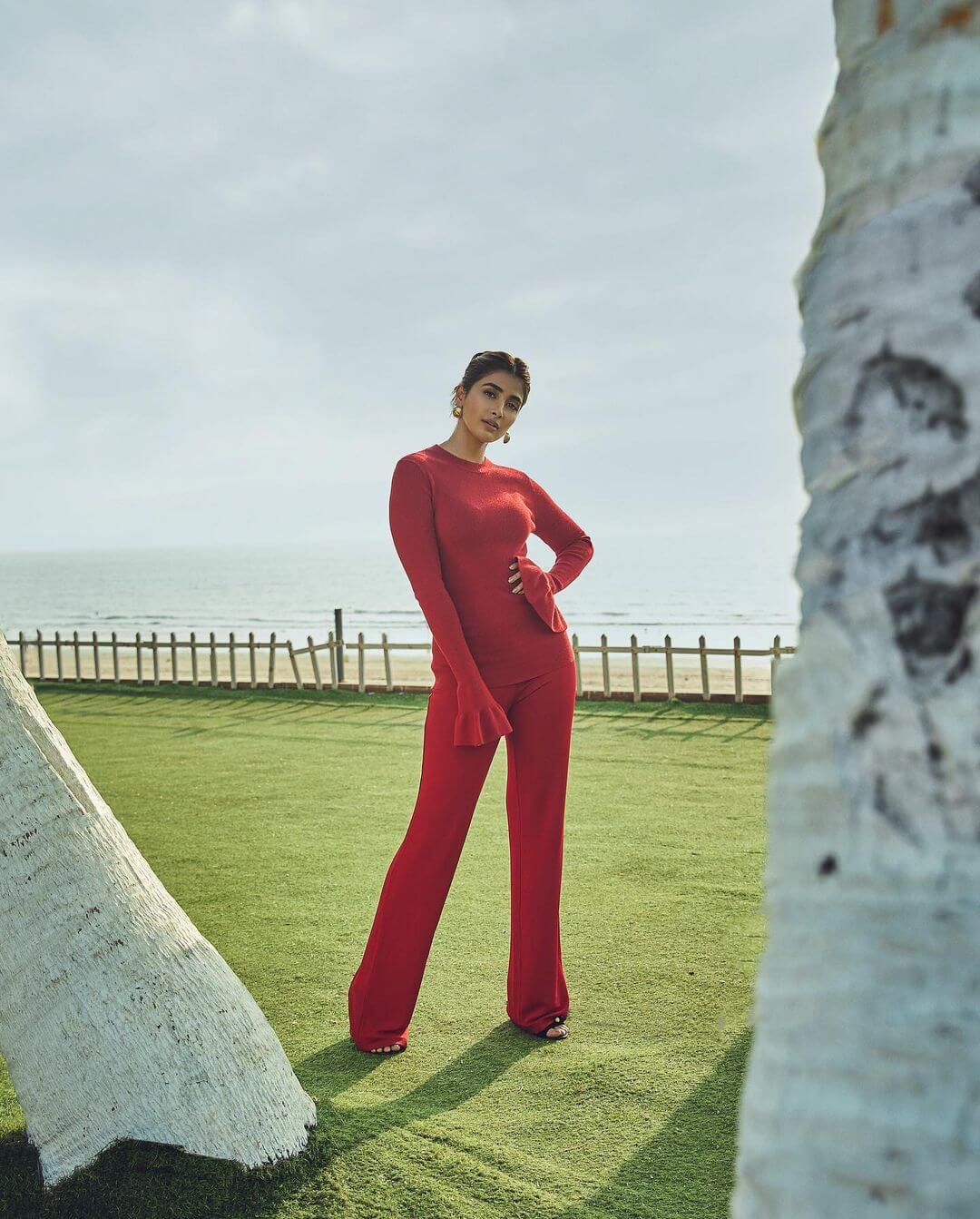 South Actress Pooja Hegde In Hot Red Sweater And Flared Pants