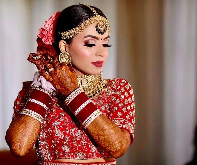 Dark Red Color Chura With White Bangles For A Wedding Look