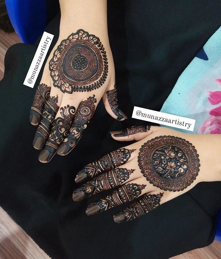 Different Mandala Designs On Two Hands