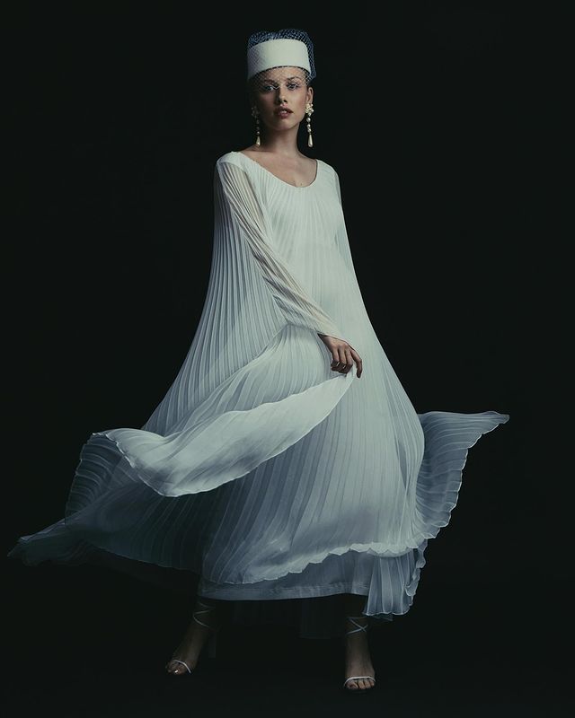 Gracie Whirls In A Sufi-Inspired White Gown
