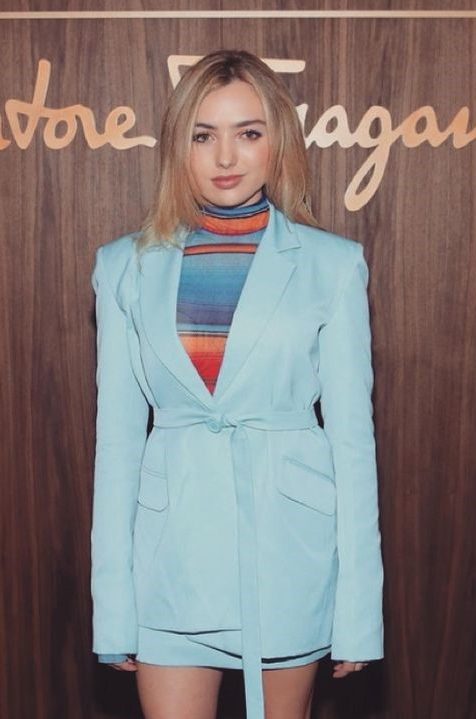 Peyton List In A Skirt Suit And Multi-Colored Turtleneck Top