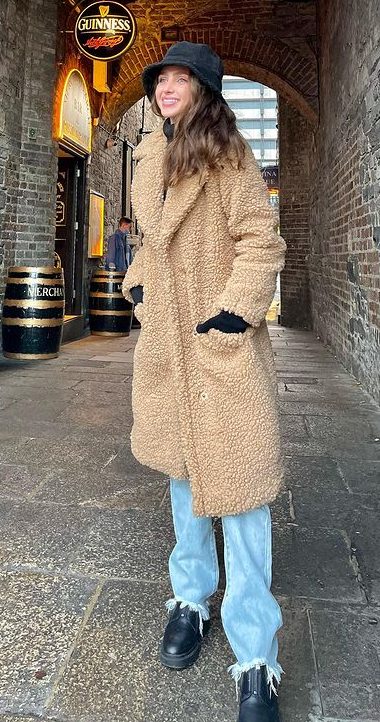Simple Street Look In Beige Colored Over-Coat And Blue Designer Jeans