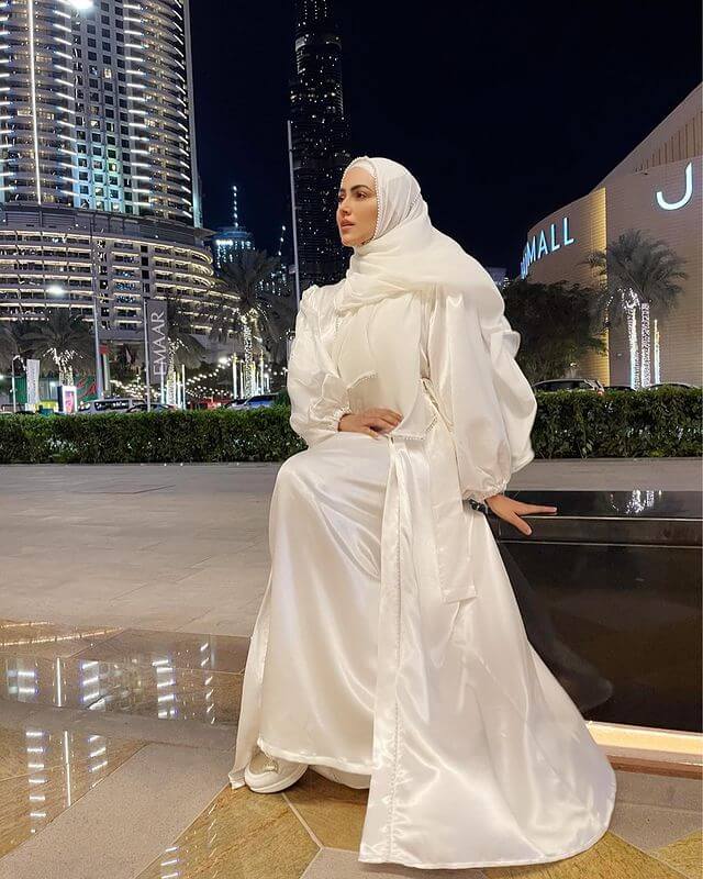 Dreamy White Abaya Of Sana Khan Paired With White Sneakers