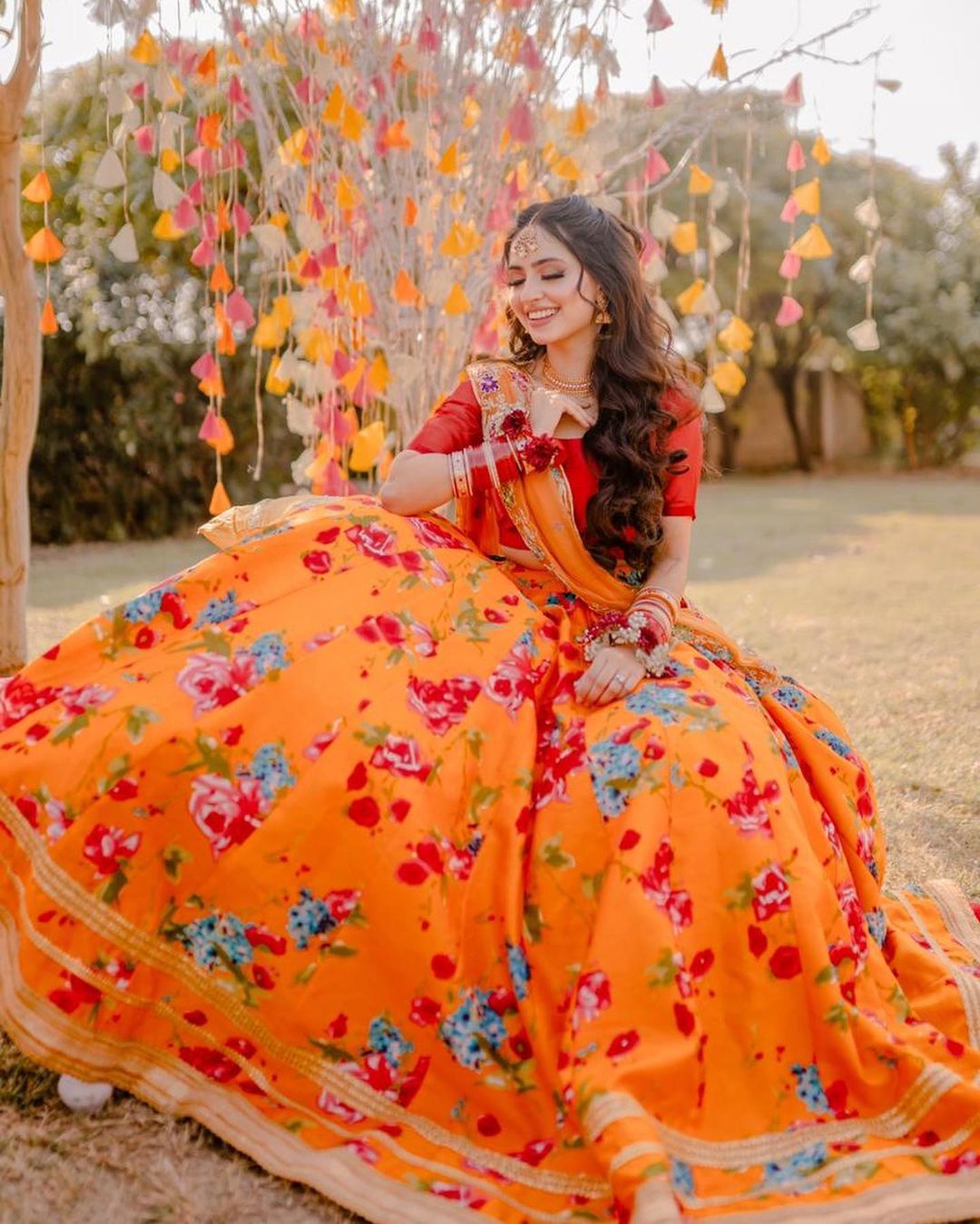 A Spectacular Floral Lehenga In Red And Orange