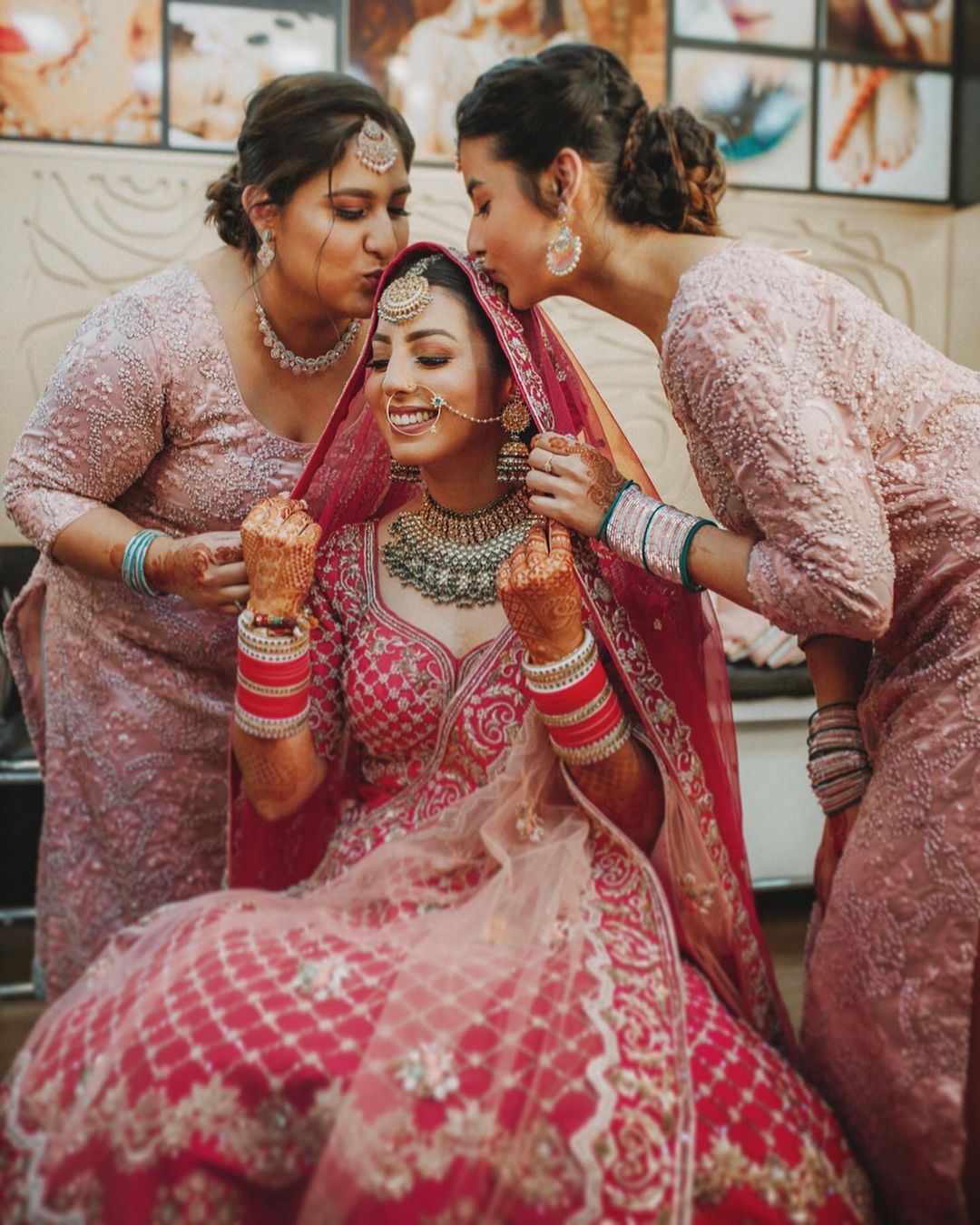 Bride's Sister poses on wedding Bridesmaids with Matching Outfits