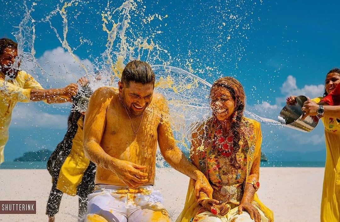 Candid Moments Of The Couple Enjoying The Splash Of Water