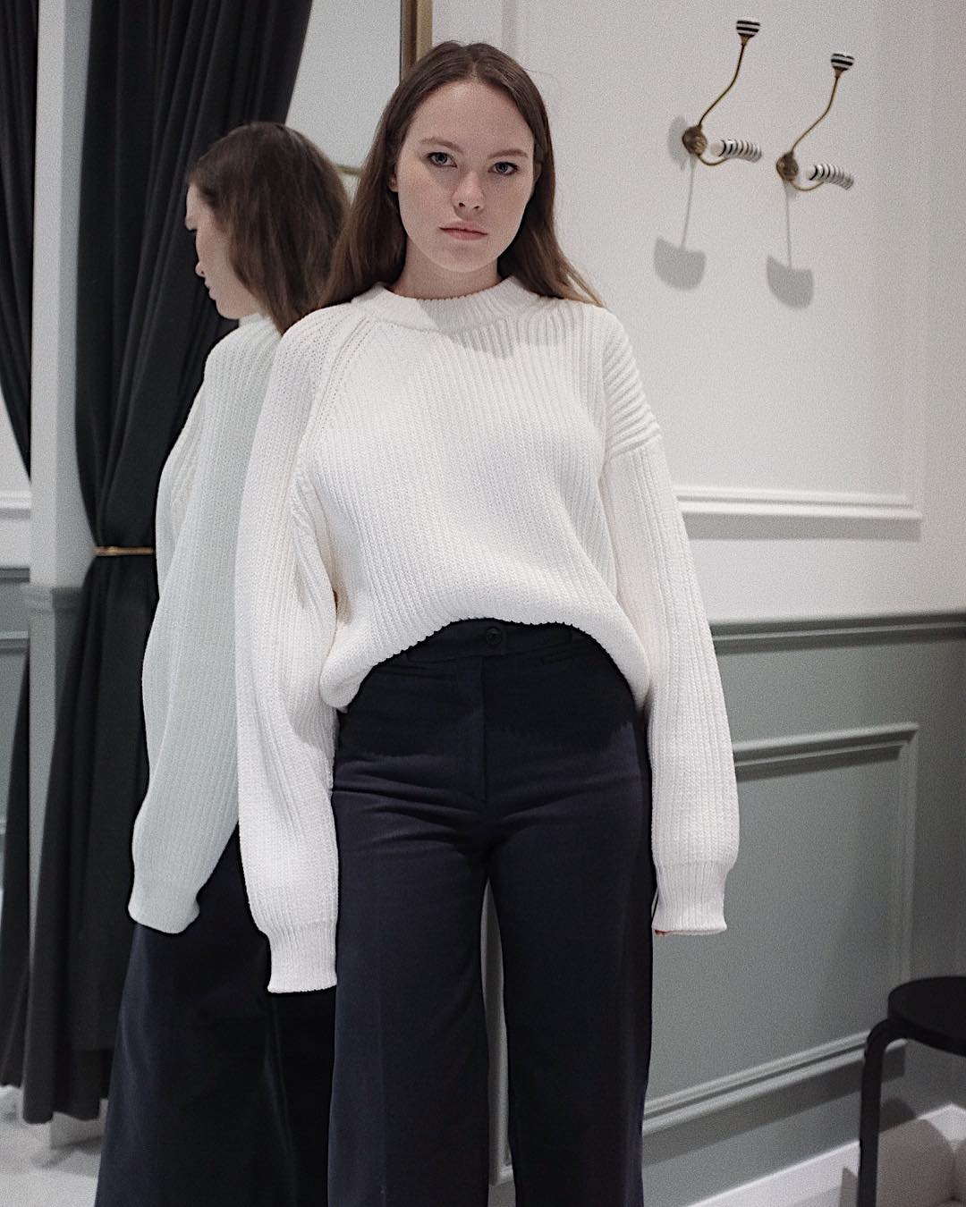 Chloe's Cool Look In White Sweater Paired With Black Pants