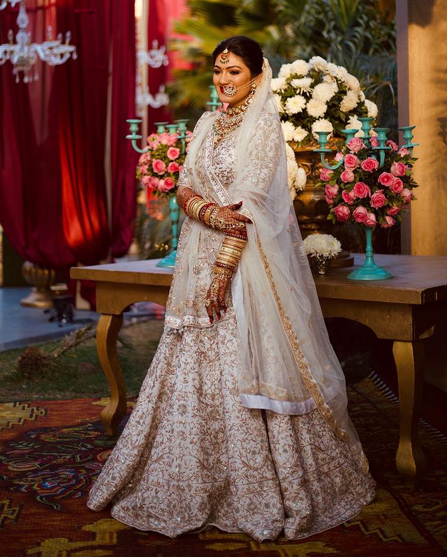 Indian Bride Wearing White And Golden Lehenga 