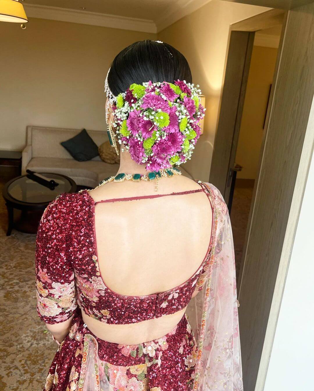 Multi-Colored Floral Bun Hairstyle For Wedding